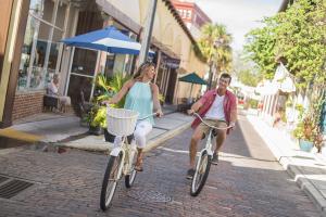A couple riding bicycles along the historic streets of St. Augustine