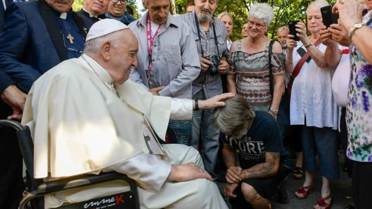 Pope Francis blesses a guest at the Centre